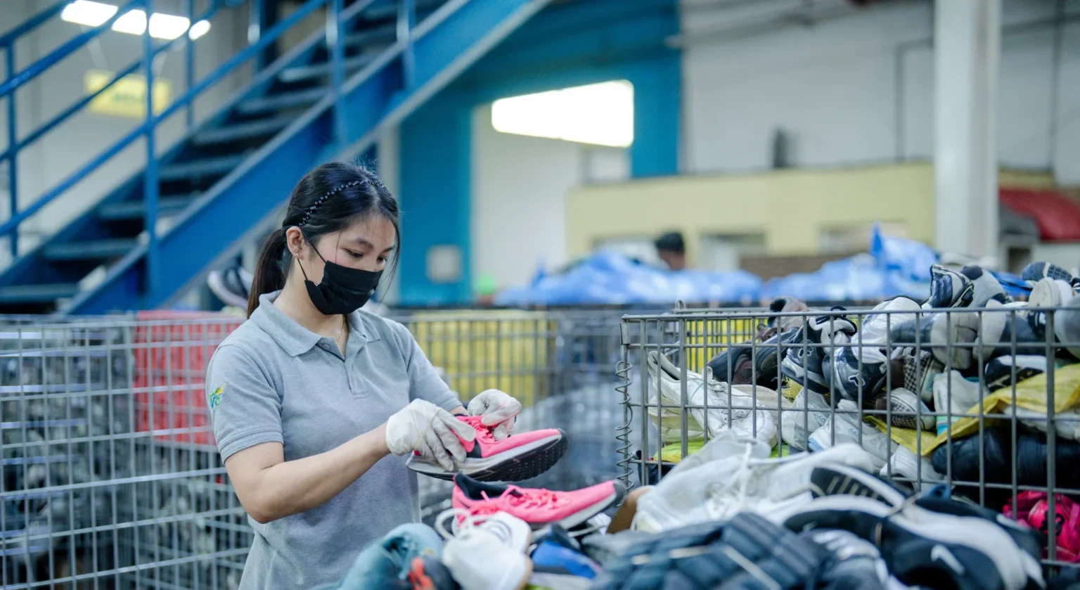 Footwear being inspected and sorted for reuse